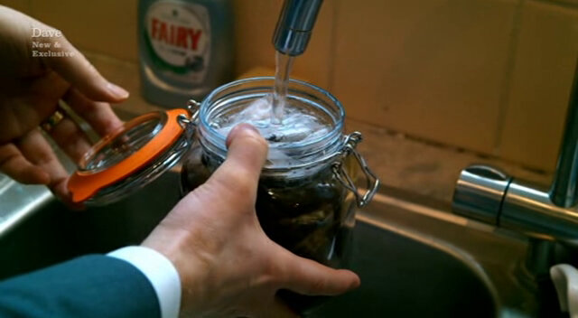 Close-up image of Frank’s hands as he fills a mason jar of teabags with water from the kitchen tap. Close-up image of Frank’s hands as he fills a mason jar of teabags with water from the kitchen tap.