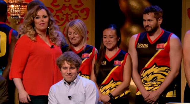 Image of Roisin Conaty trying to correctly introduce three members of an Australian Rules Football team. Image of Roisin Conaty trying to correctly introduce three members of an Australian Rules Football team.
