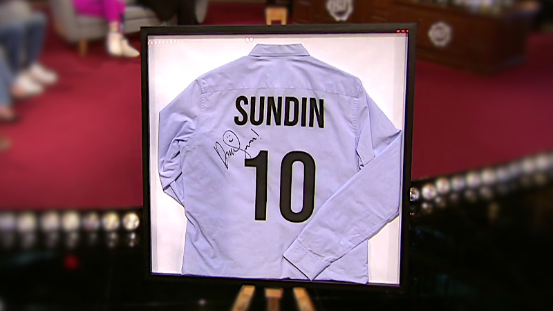 Image of the prize in this episode: the signed and framed football shirt David wore during the 'Prevent David from scoring a goal' task. Image of the prize in this episode: the signed and framed football shirt David wore during the 'Prevent David from scoring a goal' task.
