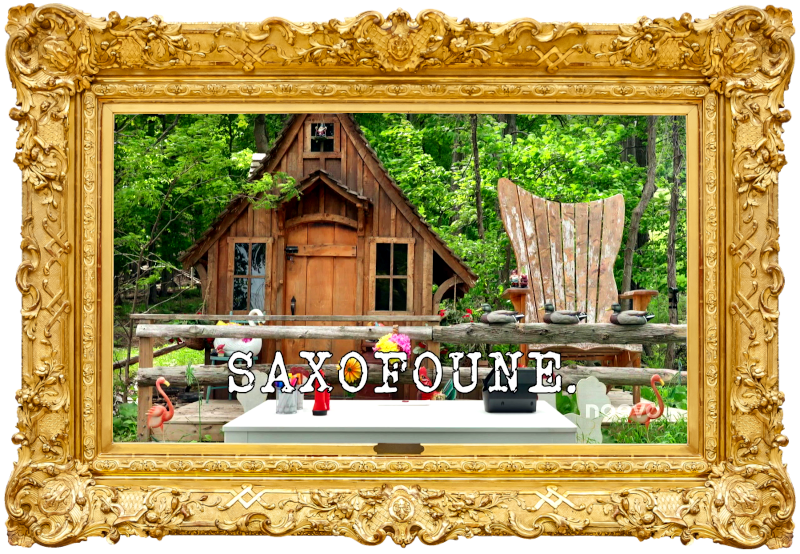 Image of some items on a table, set up outside of Antoine's cabin (a reference to the ‘Turn on the bubble machine’ task), with the episode title 'Saxofoune' ['Saxofanny'] superimposed on it.