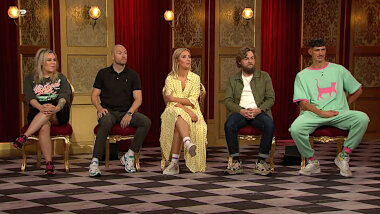 Image of the panel of contestants seated on stage together during this episode.