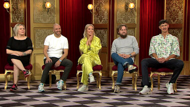 Image of the panel of contestants seated on stage together during this episode.