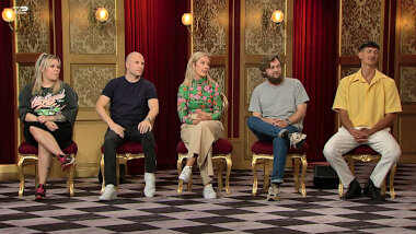Image of the panel of contestants seated on stage together during this episode.