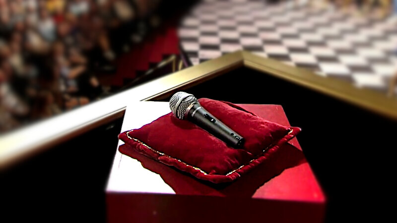 Image of the prize up for grabs in this episode: five minutes of microphone time during Simon Talbot's new stand-up show. Image of the prize up for grabs in this episode: five minutes of microphone time during Simon Talbot's new stand-up show.