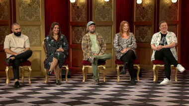 Image of the panel of contestants seated on stage together during this episode.