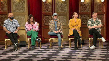 Image of the panel of contestants seated on stage together during this episode.