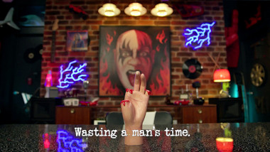 Image of a mannequin hand with three fingers missing, on the table in the study of the Taskmaster AU house (a reference to the 'Advertise a finger' task), with the episode title 'Wasting a man's time' superimposed on it.