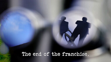 Image of the Taskmaster weather vane, reflected on the surface of the goggles of the welly-cam used in the 'Film a thrilling sequence with a welly-cam' task, with the episode title, 'The end of the franchise', superimposed on it.