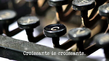 Image of the keys of a typewriter (it's unclear what in the episode this could be a reference to), with the episode title, 'Croissants is croissants', superimposed on it.
