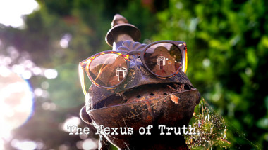 Photo of the head of Olli the garden knight statue wearing a pair of sunglasses (referencing the 'Put on the special glasses' task), with the episode title, 'The Nexus of Truth', superimposed on it.