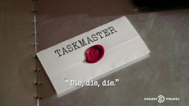 Image of a task brief laid on a metallic surface, with the episode title, 'Die, Die, Die', superimposed on it.