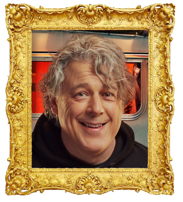 Headshot photo of Alan Davies surrounded with an ornate golden frame. Headshot photo of Alan Davies surrounded with an ornate golden frame.