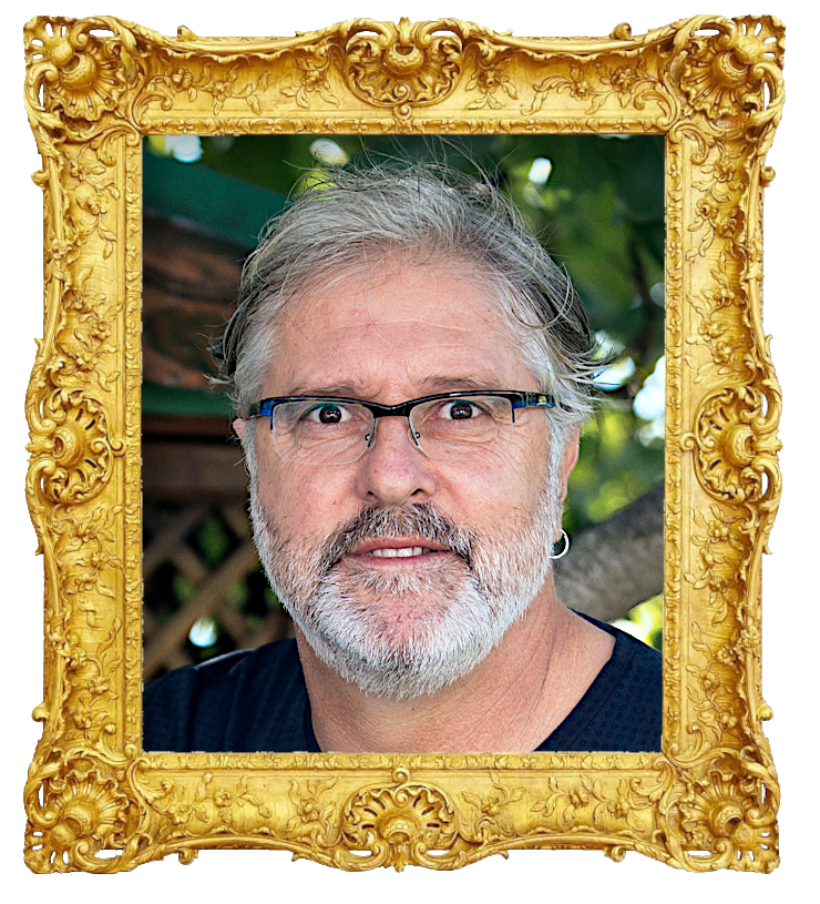 Headshot photo of Enio Mestrovic surrounded with an ornate golden frame.