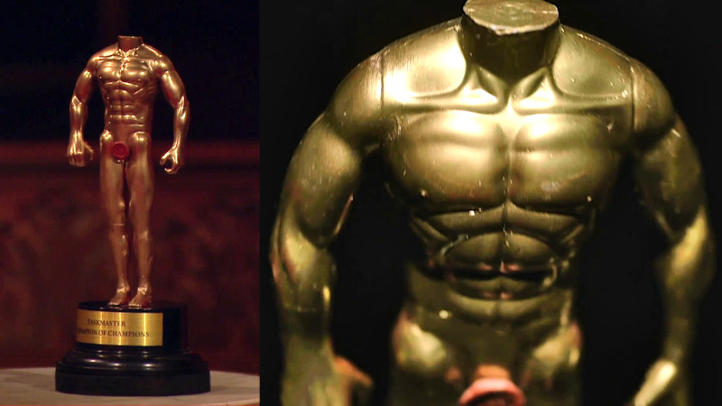 Image of the Champion of Champions prize, a golden statue of what Greg claims is his actual body. Image of the Champion of Champions prize, a golden statue of what Greg claims is his actual body.