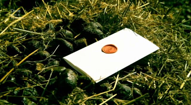 Sealed task resting on a pile of horse manure. Sealed task resting on a pile of horse manure.