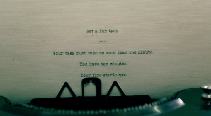 A task being composed on a typewriter. The task reads 'Set a fun task. Your task must take no more than one minute. You have 10 minutes. Your time starts now.'
