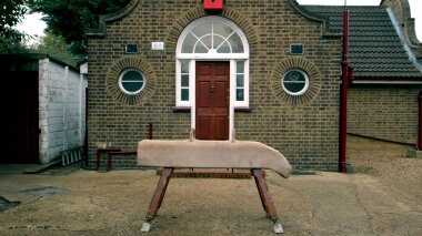 A pommel horse standing in front of the Taskmaster house.