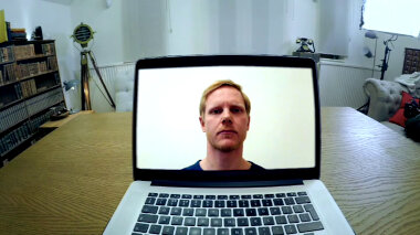An open laptop displaying a video call with Fred the Swede.