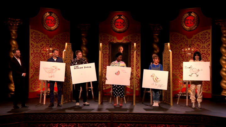 The cast of Taskmaster UK series 4 stand on stage holding their duck drawings. The cast of Taskmaster UK series 4 stand on stage holding their duck drawings.