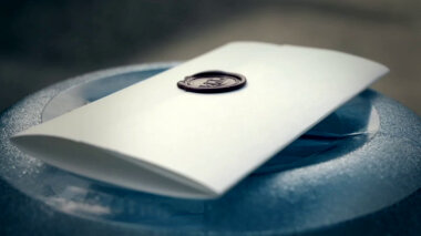 A sealed task brief resting on top of a water cooler jug.