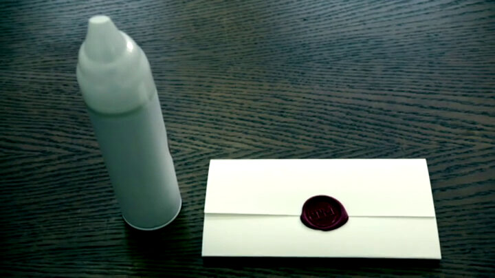 A sealed task brief next to a can of squirty cream. A sealed task brief next to a can of squirty cream.