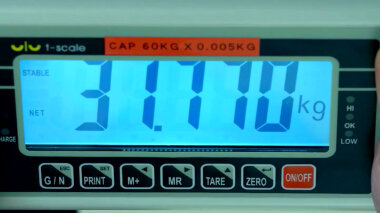 A close-up of a electronic scale. The weight reading is 31.770 kg.