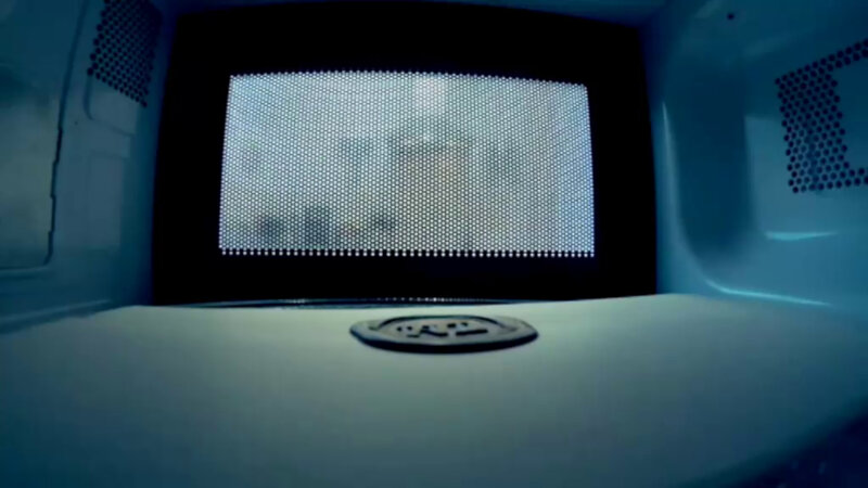 A sealed task inside a microwave oven. The shot is from inside the microwave. A sealed task inside a microwave oven. The shot is from inside the microwave.