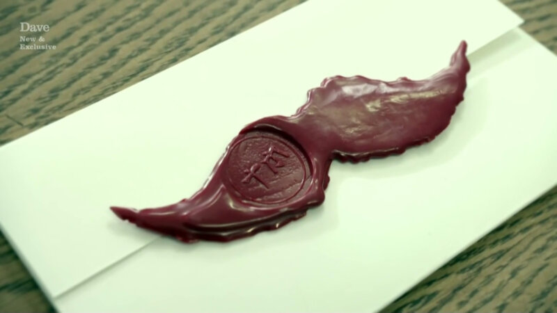 A sealed task. The seal is shaped like a moustache. A sealed task. The seal is shaped like a moustache.