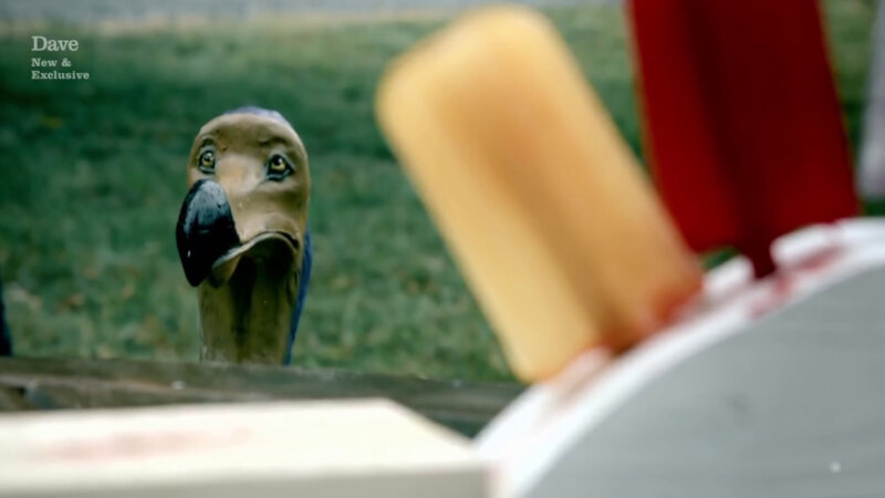 A figure of a dodo bird facing two out-of-focus ice lollies, one yellow and one red. A figure of a dodo bird facing two out-of-focus ice lollies, one yellow and one red.