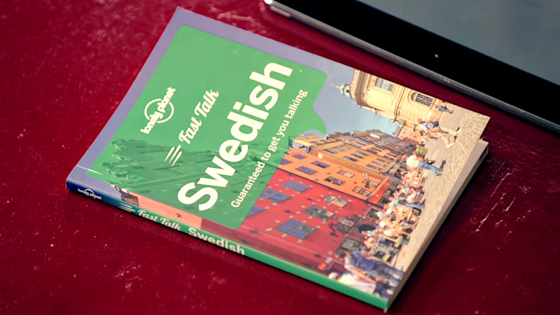 A book titled 'Swedish.' The tagline is 'Guaranteed to get you talking'. A book titled 'Swedish.' The tagline is 'Guaranteed to get you talking'.