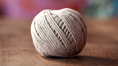 A ball of string on a table.