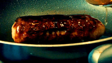 A sausage in a pan.