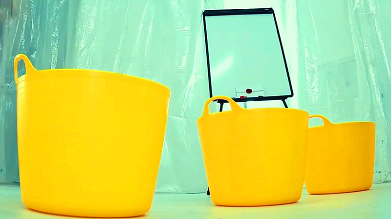 Three large, yellow, plastic hampers are on the floor of the lab. A sealed task brief rests on an easel supporting a whiteboard and markers. Three large, yellow, plastic hampers are on the floor of the lab. A sealed task brief rests on an easel supporting a whiteboard and markers.