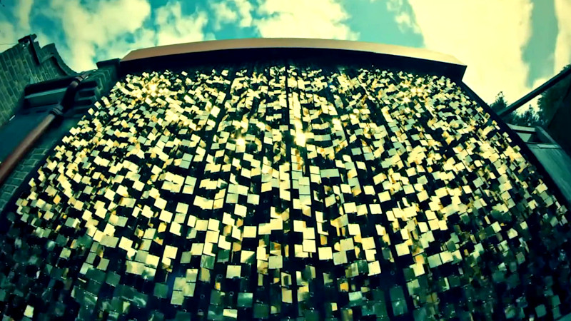 A gold-mirrored curtain attached to the wall of the house behind the stage. A gold-mirrored curtain attached to the wall of the house behind the stage.